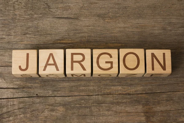 Das Wort Jargon auf einem Holzklotz — Stockfoto