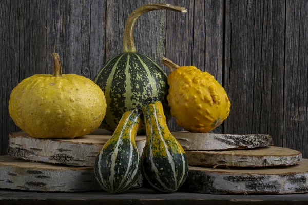 Pumpkins on a wooden background — Stock Photo, Image