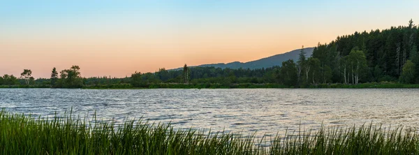 Panorama of a small lake at dusk — Stock Photo, Image