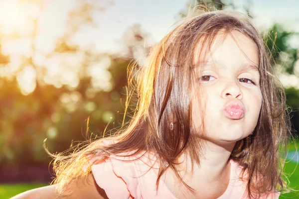 Beautiful little girl posing outdoors — Stock Photo, Image