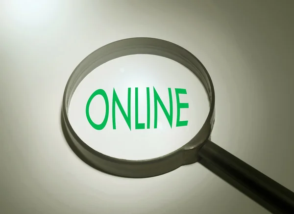 Online kelime olan büyüteç. Online arama — Stok fotoğraf