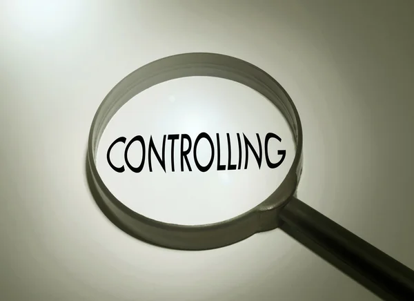 Magnifying glass with the word controlling — Stock Photo, Image