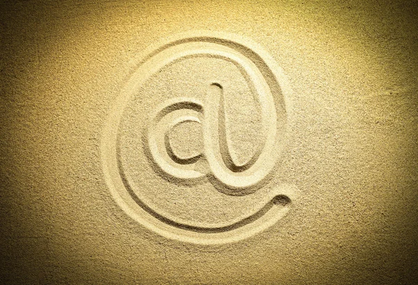 Image @ symbol in the sand — Stock Photo, Image