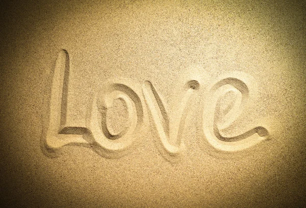 Conceito palavra de amor na areia — Fotografia de Stock