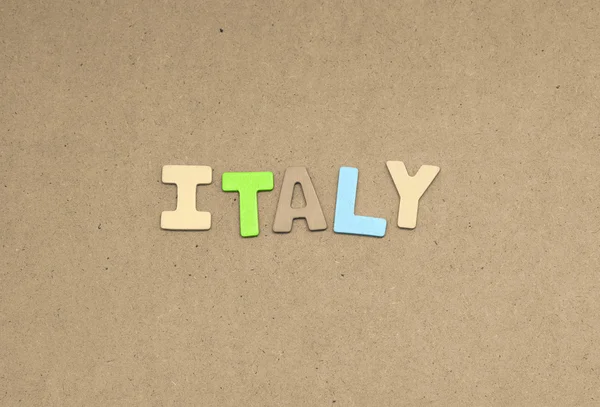 Italy text on brown background — Stock Photo, Image