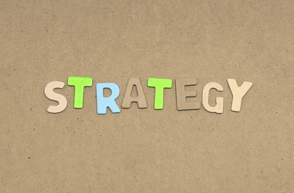 Strategi text på brun bakgrund — Stockfoto