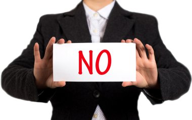 Businesswoman in a black jacket and a white shirt shows a card with the inscription no