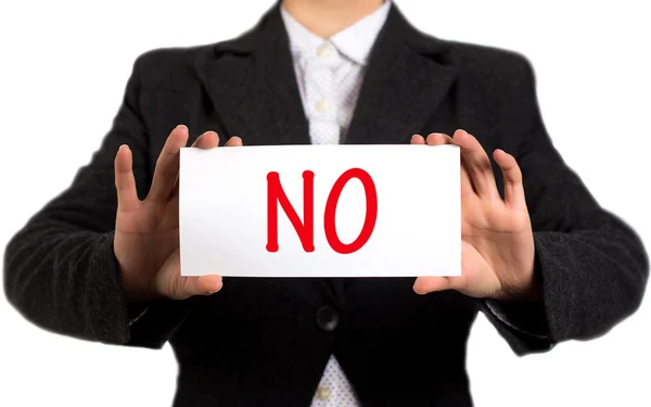 Businesswoman in a black jacket and a white shirt shows a card with the inscription no — ストック写真