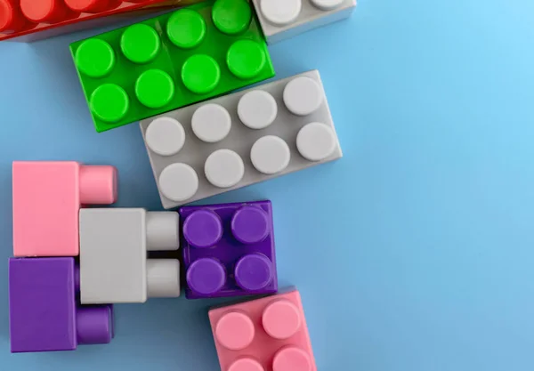 Colorful plastic toy blocks or brick toys. Child development concept.