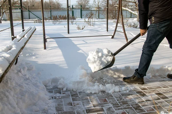 Man Removes Snow Using Snow Shovel — Stock Photo, Image