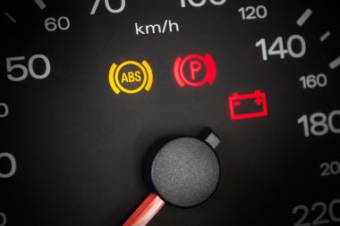 ABS light. Car dashboard in closeup clipart