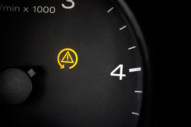 Traction control light. Car dashboard in closeup clipart
