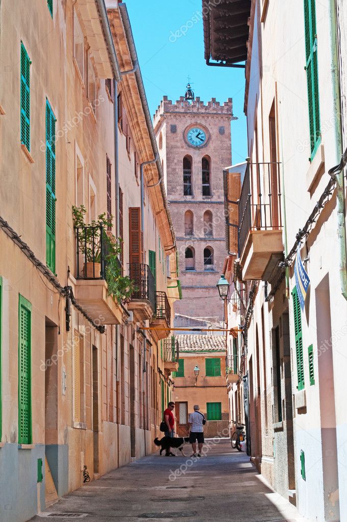 Mallorca, Balearic Islands, Spain: view of a street in the old town of Palma de Mallorca with stone buildings and pavement