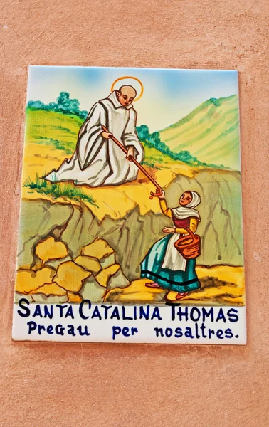 Valldemossa, Mallorca, Balearic Islands, Spain: votive ceramic tile on the houses of Valldemossa for Santa Caterina Thomas, or Santa Catalina, a Spanish religious proclaimed a saint in 1930 by Pope Pius XI Stock Picture