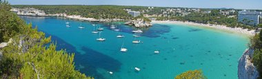 Menorca, Balearic Islands, Spain: panoramic view of the famous beach of Cala Galdana clipart