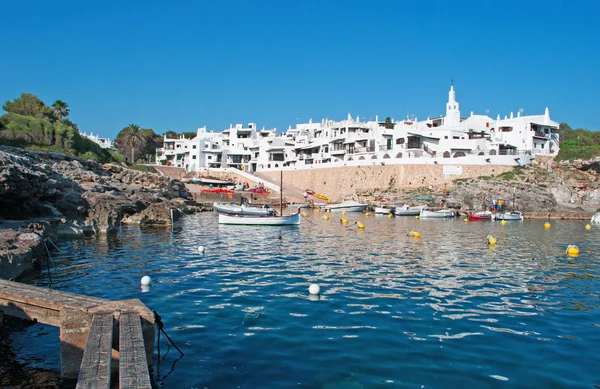 Menorca, Balearic Islands, Spain: Mediterranean Sea and the skyline of the white houses of the famous town of Binibeca Vell — Stock Photo, Image