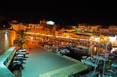 Menorca, Balearic Islands, Spain: night skyline of the old port and the city walls of Ciutadella, Ciutadella de Menorca, former capital city of the island  clipart