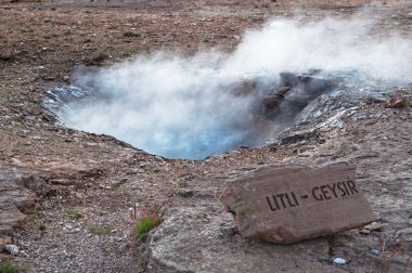 Iceland: the eruption of the Little Geysir in the Geysir area clipart