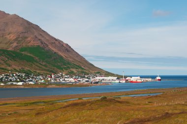 Iceland, Europe: aerial view of the fjord and the skyline of Siglufjordur, a small fishing town in a narrow fjord with the same name on the northern coast of the island, the setting for Dark Iceland, detective series by Ragnar Jonasson