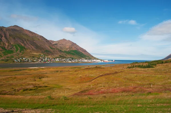 Iceland, Europe: aerial view of the fjord and the skyline of Siglufjordur, a small fishing town in a narrow fjord with the same name on the northern coast of the island, the setting for Dark Iceland, detective series by Ragnar Jonasson — Stock Photo, Image