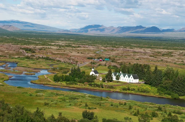 Thingvellir national park, Iceland, Europe: Thingvellir Church and Thingvallabaer farmhouse, built in 1930 for the 1000th anniversary of the Althing (national Parliament 930 AD-1798) now used as park warden office and prime minister summer house — Stock Photo, Image