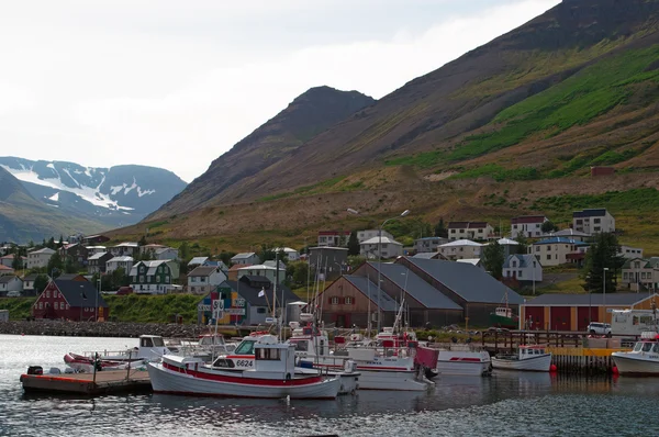 Iceland, Europe: fishing boats in the port of Siglufjordur, a small fishing town in a narrow fjord with the same name on the northern coast, the setting for Dark Iceland, detective series by Ragnar Jonasson, and the series Trapped — Stock Photo, Image