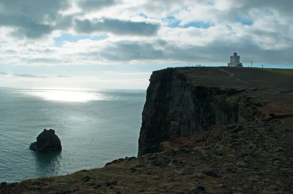 Iceland, Europe: aerial view of the breathtaking promontory of Dyrholaey and its lighthouse Dyrholaeyjarviti overlooking the bay of Vik i Myrdal, the southernmost village of the island along the Ring Road — 스톡 사진