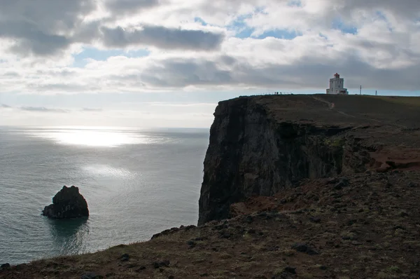 Iceland, Europe: aerial view of the breathtaking promontory of Dyrholaey and its lighthouse Dyrholaeyjarviti overlooking the bay of Vik i Myrdal, the southernmost village of the island along the Ring Road — Φωτογραφία Αρχείου