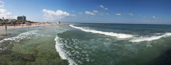 Tel Aviv, Israel, Middle East: panoramic view of the Mediterranean Sea and Metzitzim Beach, a family friendly bay and beach near the Tel Aviv Port named after a 1972 comedy film Stock Photo