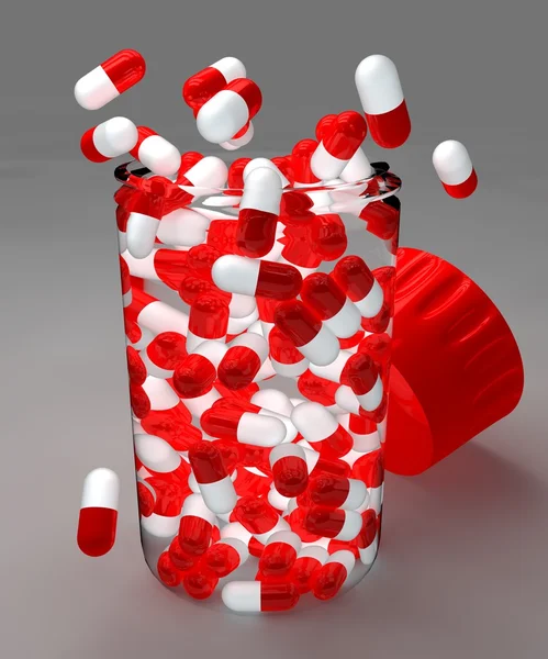 Red and white pills in bottle — Stock Photo, Image