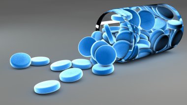 Spilled blue pills and bottle clipart