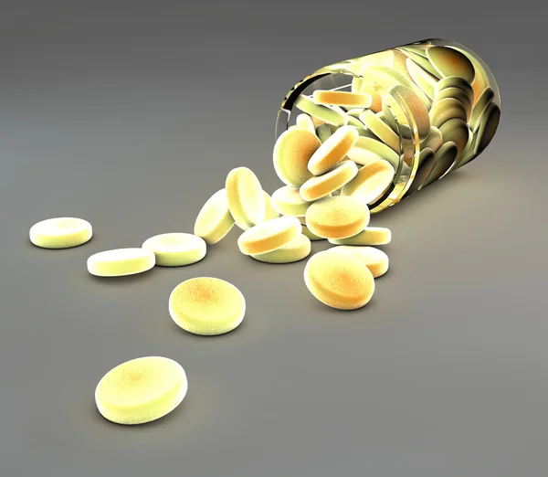 Gelbe Pillen und Flasche verschüttet — Stockfoto