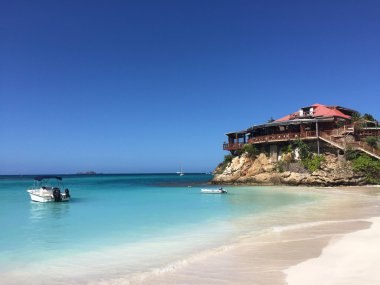 Saint Barthelemy (St Barth, St. Barths or St. Barts): panoramic view of the sandy Saint Jean beach with view of the luxury resort Eden Rock  clipart