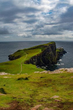 Scotland, United Kingdom: view of the sheer cliff of Neist Point lighthouse (1909), famous promontory and viewpoint on the most westerly point on the Duirinish peninsula on the Isle of Skye