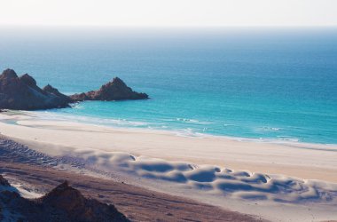Socotra, Yemen, Middle East: the breathtaking landscape with sand dunes on Qalansiyah Beach, on the western cape of the island, Unesco world heritage site since 2008  for its biodiversity, one of the most beautiful beaches in the world clipart