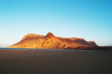 Socotra, Yemen, Middle East: the breathtaking landscape at sunset on Qalansiyah Beach, on the western cape of the island, Unesco world heritage site since 2008  for its biodiversity, one of the most beautiful beaches in the world clipart