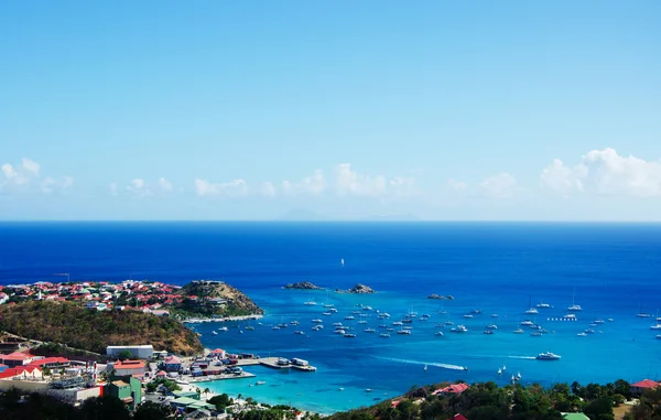 Saint Barthelemy (St Barth, St. Barths or St. Barts): aerial view of the bay and harbour of Gustavia with Fort Karl and the red roofs of the main town and capital of the island — Stock Photo, Image