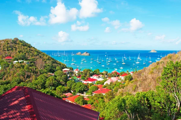 Saint Barthelemy (St Barth, St. Barths or St. Barts): aerial view of the bay and harbour of Gustavia with the red roofs of the main town and capital of the island seen from Corossol — Stock Photo, Image