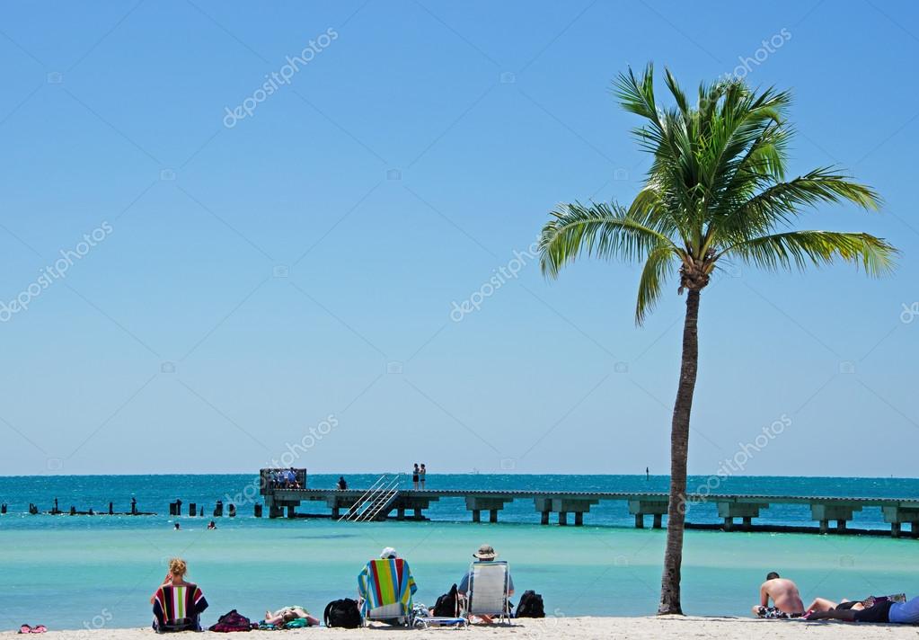 Key West people relaxing and sunbathing on Higgs Beach, the two mile