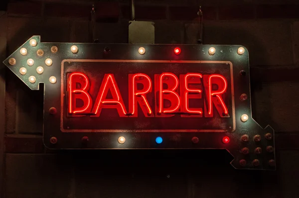 New York City, United States of America: neon sign of a barber shop inside the Chelsea Market, a food hall and shopping mall in the former National Biscuit Company (Nabisco) factory complex where the Oreo cookie was invented and produced — Stock Photo, Image