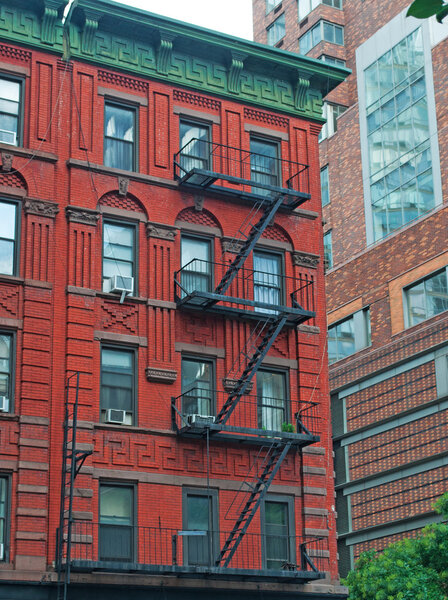 New York City, United States of America, Usa, September 16, 2014: a townhouse in the streets of SoHo Cast Iron Historic District, consisting of 26 blocks and approximately 500 buildings incorporating cast-iron architectural elements