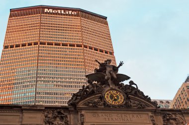 New York: the Grand Central Terminal, a commuter railroad terminal at 42nd Street, and MetLife building, one of the 100 tallest buildings in Usa, two iconic landmarks of the city in the world