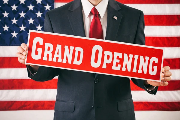 Politician: Man Holding Up Grand Opening Sign — Stock Photo, Image