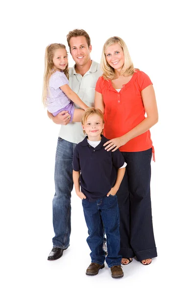 Família: Pai segura menina com mãe e filho em pé — Fotografia de Stock