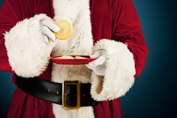 Santa: att ha socker cookie mellanmål — Stockfoto