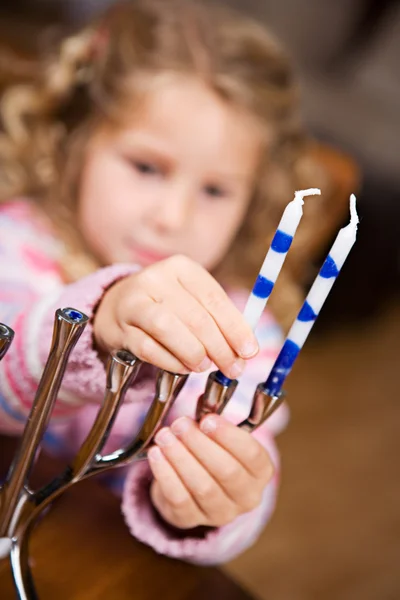 Hanukkah: Cute Girl Puts Candles Into Menorah — Stock Photo, Image