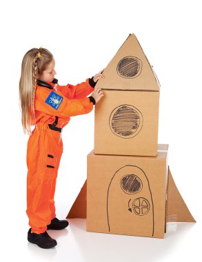 Astronaut: Girl Builds Space Ship From Boxes clipart