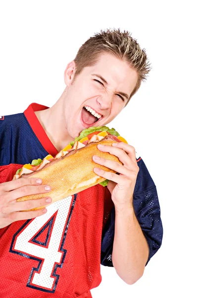 Football: Taking A Bite From Huge Sandwich Stock Picture