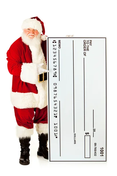 Weihnachtsmann: Weihnachtsmann mit überdimensionalem Scheck — Stockfoto