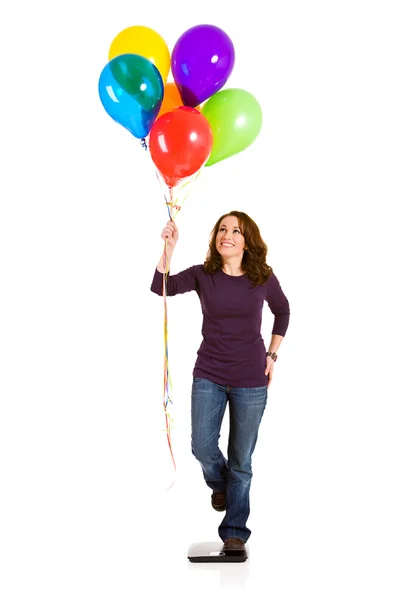 Casual: Frau versucht mit Luftballons abzunehmen — Stockfoto